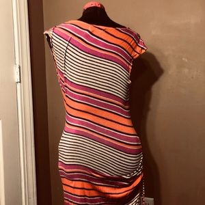Very fitted striped dress. Strings on side gather for more asymmetrical look.